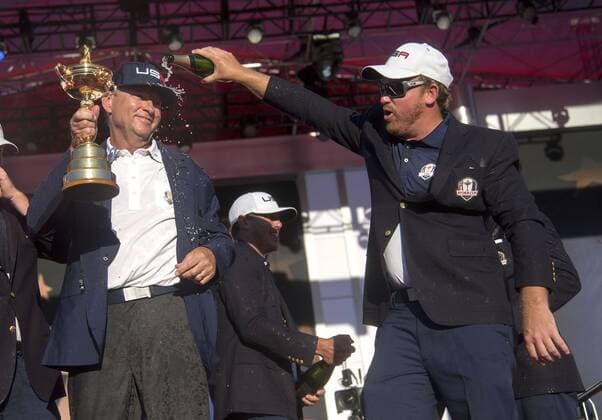 USA team member J.B. Holmes puts champaign on team captain Davis Love III after the United States defeated Europe 17-11 to win the 2016 Ryder Cup at Hazeltine National Golf Club in Chaska, Minnesota on October 2, 2016. USA defeated Europe for the first time since 2008.  MIN20161002338 KEVINxDIETSCH