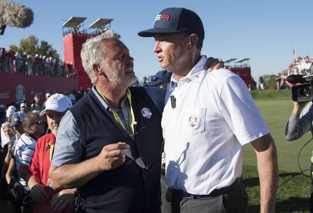USA team captain Davis Love III (R) embraces European team captain Darren Clarke after the United States defeated Europe to win the 2016 Ryder Cup at Hazeltine National Golf Club in Chaska, Minnesota on October 2, 2016. USA defeated Europe 17-11 winning the Ryder Cup for the first time since 2008.  MIN20161002365 KEVINxDIETSCH