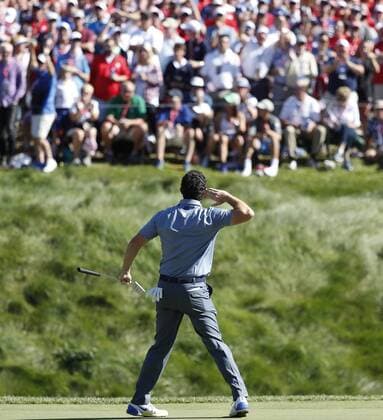 Golf, Ryder Cup 2016 in Chaska October 2, 2016 - Chaska, MN, USA - Rory McIlroy taunts the gallery to make some noise after sinking a long birdie putt on the eighth hole during match play against U.S. player Patrick Reed on Sunday, Oct. 2, 2016 at the Hazeltine National Golf Club in Chaska, Minn. Ryder Cup staying as United States closes out Europe; first victory since 2008 - ZUMAm67_