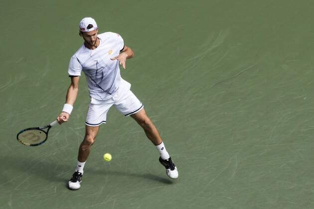 October 7, 2016 - Tokyo, Tokyo, Japan - Joao Sousa (POR) returns a shot against David Goffin (BEL) in their men s singles quarterfinal match during the japan Open tennis at the Ariake Coliseum, Tokyo. David Goffin defeated Joao Sousa with a 2-1 World News - October 7, 2016 - ZUMAc166