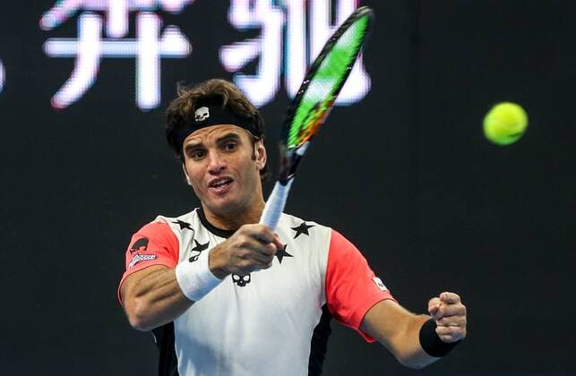 BEIJING, CHINA - OCTOBER 07: Malek Jaziri of Tunisia returns a shot against Milos Raonic of Canana during the Men s singles second round match on day seven of the 2016 China Open at the China National Tennis Centre on October 7, 2016 in Beijing, China.  CFP493436563 