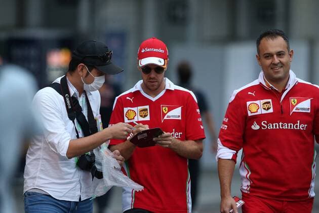 Japanese Grand Prix, Suzuka 6 - 9 October 2016 08.10.2016 - Sebastian Vettel (GER) Scuderia Ferrari SF16-H Diego Ioverno (ITA) Ferrari Operations Director 