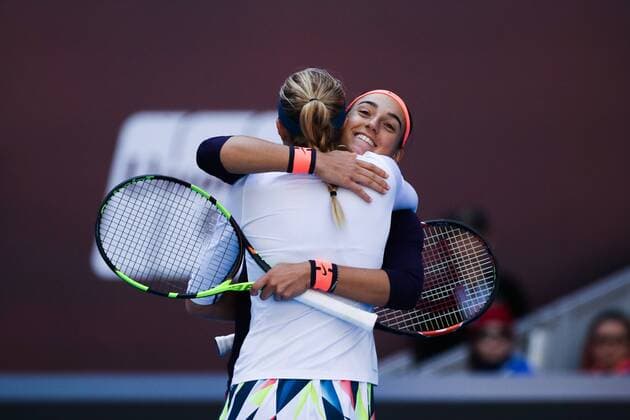 BEIJING, CHINA - OCTOBER 08: Caroline Garcia and Kristina Mladenovic of France hug after winning the Women s doubles semifinals against Hao-Ching Chan and Yung-Jan Chan of Chinese Taipei on day eight of the 2016 China Open at the China National Tennis Centre on October 8, 2016 in Beijing, China.  CFP493487111 