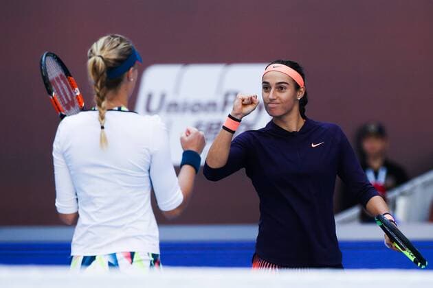 BEIJING, CHINA - OCTOBER 08: Caroline Garcia and Kristina Mladenovic of France celebrate after winning the Women s doubles semifinals against Hao-Ching Chan and Yung-Jan Chan of Chinese Taipei on day eight of the 2016 China Open at the China National Tennis Centre on October 8, 2016 in Beijing, China.  CFP493487112 