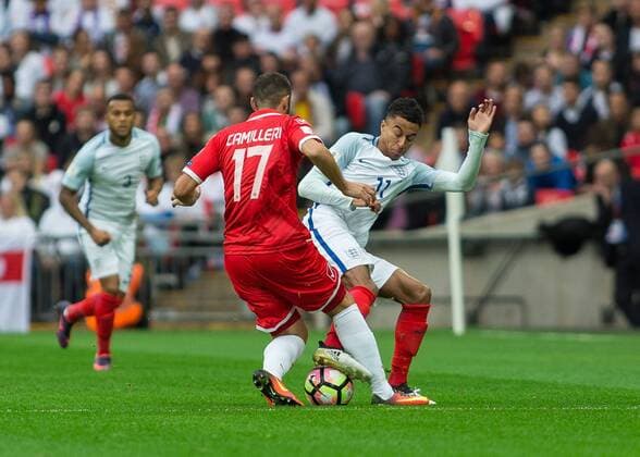 Football - 2016 2016 World Cup Qualifier - Group F: England vs. Malta England s Jesse Lingaard blocks the advance of Malta s Ryan Camilleri at Wembley. COLORSPORT DANIEL BEARHAM  whu_mid
