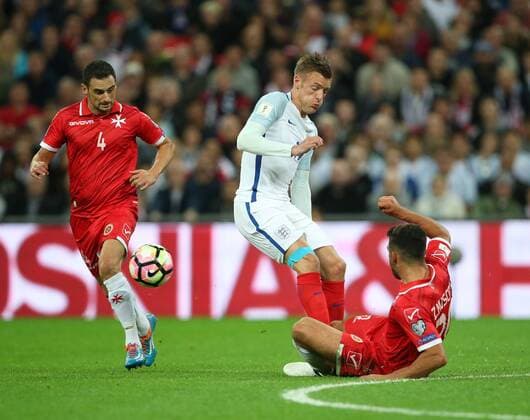 England s Jamie Vardy tussles with Malta s Zach Muscat during the World Cup Qualifying Group F match at Wembley Stadium, London. Picture date October 8th, 2016 Pic David Klein Sportimage EDITORIAL USE ONLY. No use with unauthorised audio, video, data, fixture lists, club league logos or live services. Online in-match use limited to 120 images, no video emulation. No use in betting, games or single club league player publications.