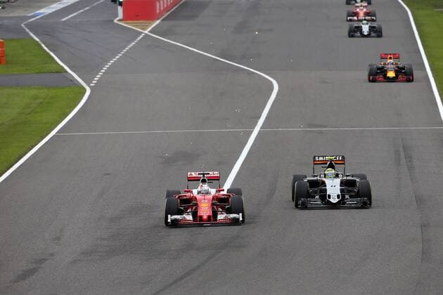 Japanese Grand Prix, Suzuka 6 - 9 October 2016 09.10.2016 - Race, Sebastian Vettel (GER) Scuderia Ferrari SF16-H and Sergio Perez (MEX) Sahara Force India F1 VJM09 