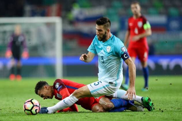 SOCCER - FIFA World Cup WM Weltmeisterschaft Fussball 2018 quali, SLO vs ENG LJUBLJANA,SLOVENIA,11.OCT.16 - SOCCER - FIFA World Cup 2018, european qualifiers, international match Länderspiel Slovenia vs England. Image shows Dele Alli (ENG) and Bostjan Cesar (SLO). GEPAxpictures xMaticxKlansek