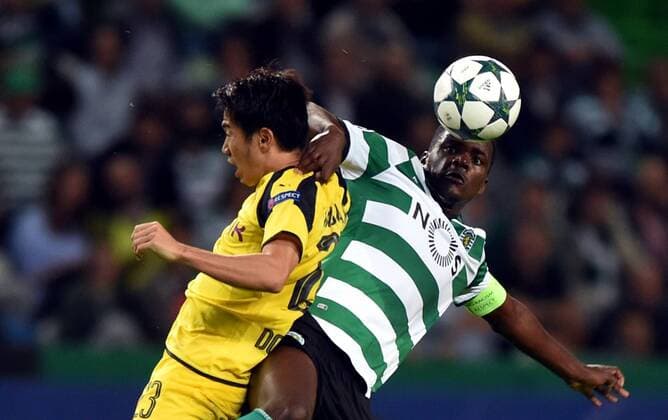 LISBON, Oct. 18, 2016 -- Sporting s William Carvalho (R) vies with Dortmund s Shinji Kagawa during the UEFA Champions League football match between Sporting CP and BVB Borussia Dortmund in Lisbon, Portugal, Oct. 18, 2016. Sporting lost 1-2. ) (SP)PORTUGAL-LISBON-FOOTBALL-UEFA CHAMPIONS LEAGUE ZhangxLiyun 
