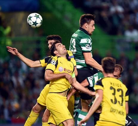LISBON, Oct. 18, 2016 -- Dortmund s Marc Bartra (L1) vies with Sporting s Sebastian Coates (top) during the UEFA Champions League football match between Sporting CP and BVB Borussia Dortmund in Lisbon, Portugal, Oct. 18, 2016. Sporting lost 1-2. ) (SP)PORTUGAL-LISBON-FOOTBALL-UEFA CHAMPIONS LEAGUE ZhangxLiyun 