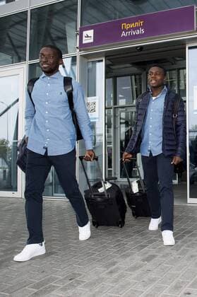 Gent s Nana Asare and Gent s Moses Simon pictured during the arrival of Belgian soccer team KAA Gent, Wednesday 19 October 2016, in Lviv, Ukraine. Tomorrow Gent is playing Ukraine club Shaktar Donetsk in the third match of the group stage of the Europa League competition. JASPERxJACOBS  x04960416x