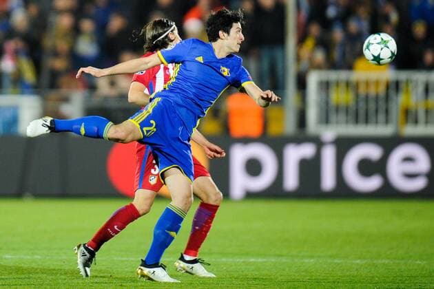 ROSTOV-ON-DON, RUSSIA - OCTOBER 19, 2016: Atletico Madrid s Filipe Luis (L) and Rostov s Sardar Azmoun fight for the ball in their 2016-17 Season UEFA Champions League Group D Round 3 football match at the Olimp-2 Stadium. Valery Matytsin TASS  TS034F26