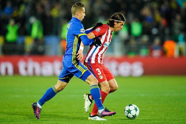 ROSTOV-ON-DON, RUSSIA - OCTOBER 19, 2016: Rostov s Igor Kireyev (L) and Atletico Madrid s Filipe Luis fight for the ball in their 2016-17 Season UEFA Champions League Group D Round 3 football match at the Olimp-2 Stadium. Valery Matytsin TASS  TS034F28