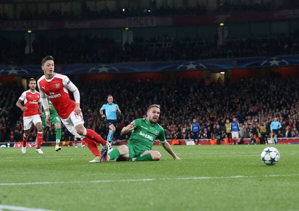 Arsenal s Mesut Ozil scoring his sides fourth goal during the Champions League group A match at the Emirates Stadium, London. Picture date October 19th, 2016 Pic David Klein Sportimage EDITORIAL USE ONLY. No use with unauthorised audio, video, data, fixture lists, club league logos or live services. Online in-match use limited to 120 images, no video emulation. No use in betting, games or single club league player publications.
