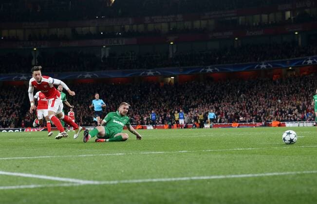 Arsenal s Mesut Ozil scoring his sides fourth goal during the Champions League group A match at the Emirates Stadium, London. Picture date October 19th, 2016 Pic David Klein Sportimage EDITORIAL USE ONLY. No use with unauthorised audio, video, data, fixture lists, club league logos or live services. Online in-match use limited to 120 images, no video emulation. No use in betting, games or single club league player publications.