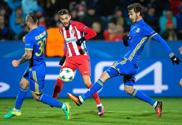 ROSTOV-ON-DON, RUSSIA - OCTOBER 19, 2016: Atletico Madrid s Yannick Carrasco (C) and Rostov s Fyodor Kudryashov (L), Alexander Yerokhin (R) fight for the ball in their 2016-17 Season UEFA Champions League Group D Round 3 football match at the Olimp-2 Stadium. Valery Matytsin TASS  TS034F2A