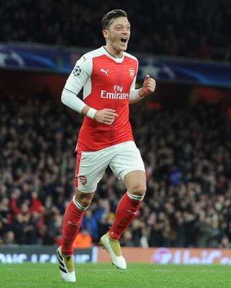 Football - 2016 2016 Champions League - Arsenal vs. PFC Ludogorets Razgrad Mesut Ozil of Arsenal celebrates the third goal of his hat trick at The Emirates. COLORSPORT ANDREW COWIE 