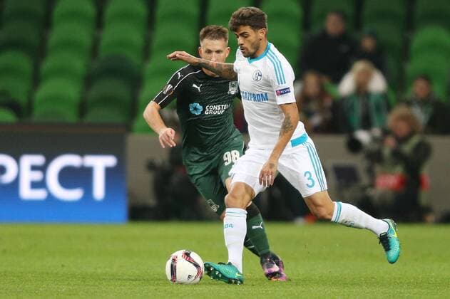 KRASNODAR, RUSSIA - OCTOBER 20, 2016: FC Krasnodar s Sergei Petrov (L) and FC Schalke 04 s Junior Caicara fight for the ball in their 2016 17 Season UEFA Europa League Group I Round 3 football match at Krasnodar Stadium. Vitaly Timkiv TASS  TS0350C1