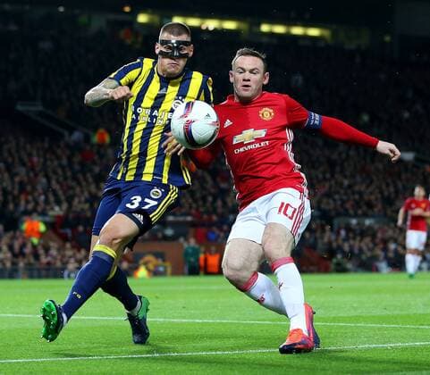 Martin Skrtel of Fenerbahce battles with Wayne Rooney of Manchester United ManU during the UEFA Europa League match at Old Trafford, Manchester. Picture date: October 20th, 2016. Pic Matt McNulty Sportimage EDITORIAL USE ONLY. No use with unauthorised audio, video, data, fixture lists, club league logos or live services. Online in-match use limited to 120 images, no video emulation. No use in betting, games or single club league player publications.
