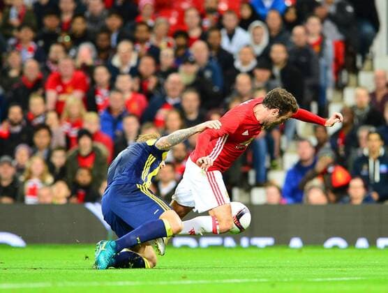 UEFA Europa League Group A day 3 match between Manchester United ManU and Fenerbahce at Old Trafford Stadium in Manchester , England , October 20 , 2016. Final Score: Manchester United 4 - Fenerbhace 1 Pictured: Simon Kjaer of Fenerbahce and Juan Mata of Manchester United. 