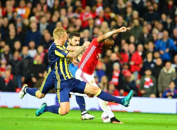 UEFA Europa League Group A day 3 match between Manchester United ManU and Fenerbahce at Old Trafford Stadium in Manchester , England , October 20 , 2016. Final Score: Manchester United 4 - Fenerbhace 1 Pictured: Sener Ozbayrakli , Simon Kjaer of Fenerbahce and Anthony Martial (C) of Manchester United. 