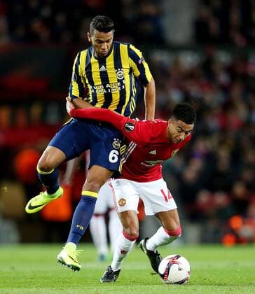 Jesse Lingard of Manchester United ManU is challenged by Souza of Fenerbahce during the UEFA Europa League match at Old Trafford, Manchester. Picture date: October 20th, 2016. Pic Matt McNulty Sportimage EDITORIAL USE ONLY. No use with unauthorised audio, video, data, fixture lists, club league logos or live services. Online in-match use limited to 120 images, no video emulation. No use in betting, games or single club league player publications.