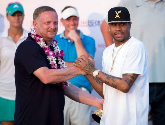 October 23, 2016 - Haikou, Hainan, China - Basketball player Allen Iverson lays a runners lay on footballer David May.Prize presentation ceremony at the Blackstone course in Mission Hills resort Haikou during the 2nd round of the 4th World celebrity Pro-am. .Blackstone course, Mission Hills resort, Haikou, Hainan Island China. Round 2 of the Mission Hills 4th World celebrity Pro-Am tournament 2016 - ZUMAr144 20161023_zap_r144_017