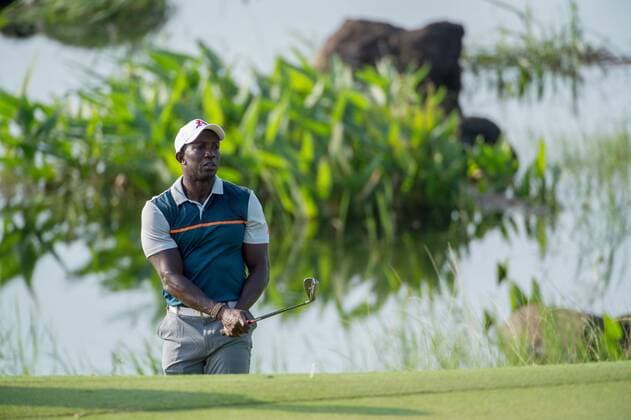 October 23, 2016 - Haikou, Hainan, China - Footballer Dwight Yorke shoots out of a bunker as part of the winning team play on Blackstone course in Mission Hills resort Haikou during the 2nd round of the 4th World celebrity Pro-am. .Blackstone course, Mission Hills resort, Haikou, Hainan Island China. Round 2 of the Mission Hills 4th World celebrity Pro-Am tournament 2016 - ZUMAr144 20161023_zap_r144_012