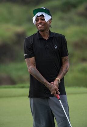 October 23, 2016 - Haikou, Hainan, China - Allen Iverson tries a putt with the help of pro John Daly of the 17th at Blackstone course in Mission Hills resort Haikou during the 2nd round of the 4th World celebrity Pro-am. .Blackstone course, Mission Hills resort, Haikou, Hainan Island China. Round 2 of the Mission Hills 4th World celebrity Pro-Am tournament 2016 - ZUMAr144 20161023_zap_r144_016