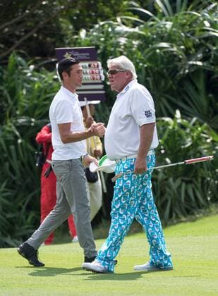October 23, 2016 - Haikou, Hainan, China - Footballer Luis Javier Garcia Sanz is congratulated by professional golfer John Daly (R) on a good putt.on the 16th hole of the Blackstone course in Mission Hills resort Haikou during the 2nd round of the 4th World celebrity Pro-am. .Blackstone course, Mission Hills resort, Haikou, Hainan Island China. Round 2 of the Mission Hills 4th World celebrity Pro-Am tournament 2016 - ZUMAr144 20161023_zap_r144_025