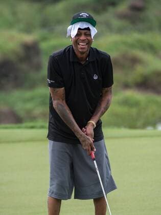 October 23, 2016 - Haikou, Hainan, China - Allen Iverson tries a putt with the help of pro John Daly of the 17th at Blackstone course in Mission Hills resort Haikou during the 2nd round of the 4th World celebrity Pro-am. .Blackstone course, Mission Hills resort, Haikou, Hainan Island China. Round 2 of the Mission Hills 4th World celebrity Pro-Am tournament 2016 - ZUMAr144 20161023_zap_r144_043