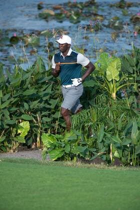 October 23, 2016 - Haikou, Hainan, China - Footballer Dwight Yorke walks the 18th fairway of Blackstone course in Mission Hills resort Haikou during the 2nd round of the 4th World celebrity Pro-am. .Blackstone course, Mission Hills resort, Haikou, Hainan Island China. Round 2 of the Mission Hills 4th World celebrity Pro-Am tournament 2016 - ZUMAr144 20161023_zap_r144_055