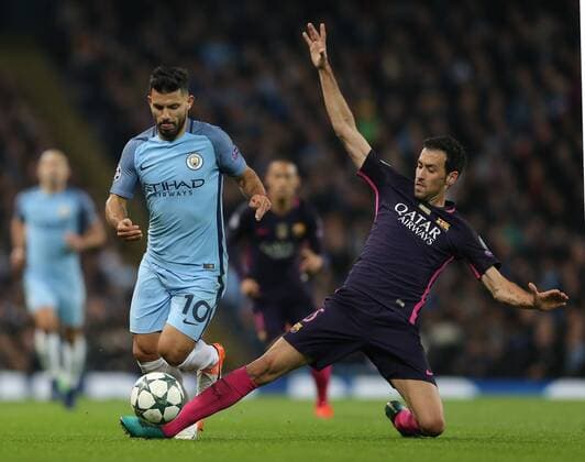 Sergio Aguero of Manchester City jumps over the Sergio Busquets of Barcelona during the Champions League Group C match at the Etihad Stadium, Manchester. Picture date: November 1st, 2016. Pic Simon Bellis Sportimage EDITORIAL USE ONLY. No use with unauthorised audio, video, data, fixture lists, club league logos or live services. Online in-match use limited to 120 images, no video emulation. No use in betting, games or single club league player publications.