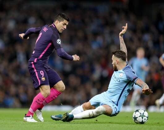 Luis Suarez of Barcelona tackled by Nicolas Otamendi of Manchester City during the Champions League Group C match at the Etihad Stadium, Manchester. Picture date: November 1st, 2016. Pic Simon Bellis Sportimage EDITORIAL USE ONLY. No use with unauthorised audio, video, data, fixture lists, club league logos or live services. Online in-match use limited to 120 images, no video emulation. No use in betting, games or single club league player publications.