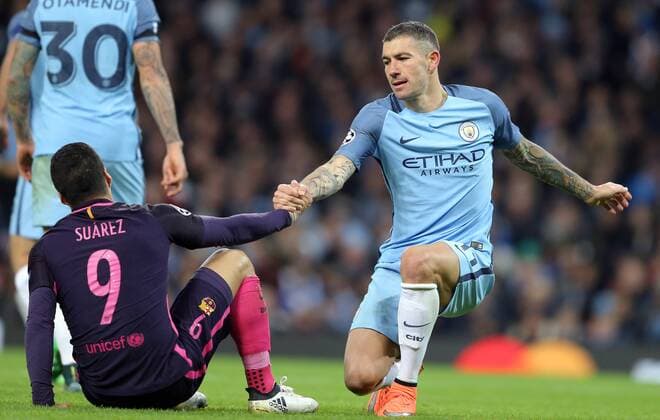 Luis Suarez of Barcelona is helped up by Aleksander Kolarov of Manchester City during the Champions League Group C match at the Etihad Stadium, Manchester. Picture date: November 1st, 2016. Pic Simon Bellis Sportimage EDITORIAL USE ONLY. No use with unauthorised audio, video, data, fixture lists, club league logos or live services. Online in-match use limited to 120 images, no video emulation. No use in betting, games or single club league player publications.
