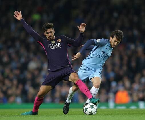 Andre Gomes of Barcelona tussles with David Silva of Manchester City during the Champions League Group C match at the Etihad Stadium, Manchester. Picture date: November 1st, 2016. Pic Simon Bellis Sportimage EDITORIAL USE ONLY. No use with unauthorised audio, video, data, fixture lists, club league logos or live services. Online in-match use limited to 120 images, no video emulation. No use in betting, games or single club league player publications.