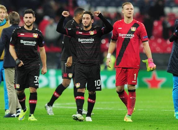 Football - 2016 2017 UEFA Champions League - Group E: Tottenham Hotspur vs. Bayer Leverkusen Kevin Volland , Hakan Calhanoglu and Goalkeeper Bernd Leno of Bayer 04 Leverkusen celebrate with the fans after the match at Wembley. COLORSPORT ANDREW COWIE 