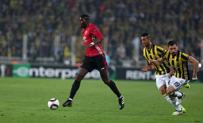 Manchester United ManU s Paul Pogba and Fenerbahce s Sener Ozbayrakli vie for the ball during a UEFA European League, group A soccer match, between Fenerbahce and Manchester United at Fenerbahce Ulker Arena in Istanbul, 3rd of November, 2016. (Tolga Adanali - Depo Photos)  15552949