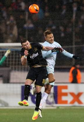 ST PETERSBURG, RUSSIA - NOVEMBER 3, 2016: Dundalk s Ciaran Kilduff (L) and Zenit St Petersburg s Domenico Criscito fight for the ball in their 2016-17 Season UEFA Europa League Group D football match at the Petrovsky Stadium. FC Zenit St Petersburg won the game 2-1. Peter Kovalev TASS  TS036777
