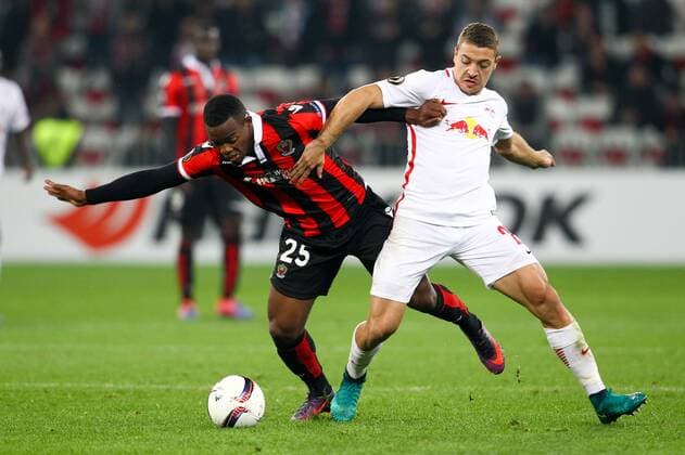SOCCER - EL, Nice vs RBS NICE,FRANCE,03.NOV.16 - SOCCER - UEFA Europa League, group stage, OGC Nice vs Red Bull Salzburg. Image shows Wylan Cyprien (Nice) and Josip Radosevic (RBS). GEPAxpictures xFelixxRoittner