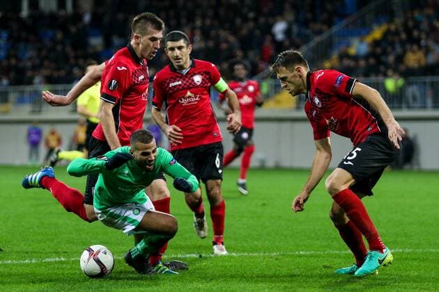 Azerbaijan: Europa League: FC Qabala - Saint Etienne Saint Etienne Oussama Tannane (L) vies for the ball with FC Qabala s player Filip Ozobic (C) Vitaliy Vernydub (R 15) during the Europa League match between FC Qabala and Saint Etienne at 8km stadium in Baku.  AzizxKarimov PacificxPress