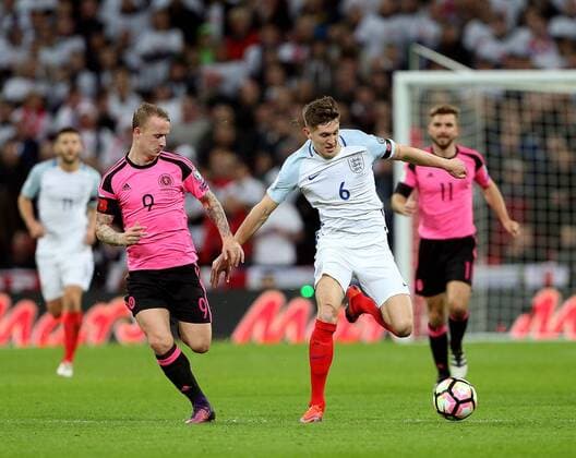 Leigh Griffiths of Scotland tussles with John Stones of England during the FIFA World Cup WM Weltmeisterschaft Fussball Qualifying Group F match at Wembley Stadium, London. Picture date: November 11th, 2016. Pic David Klein Sportimage EDITORIAL USE ONLY. No use with unauthorised audio, video, data, fixture lists, club league logos or live services. Online in-match use limited to 120 images, no video emulation. No use in betting, games or single club league player publications.