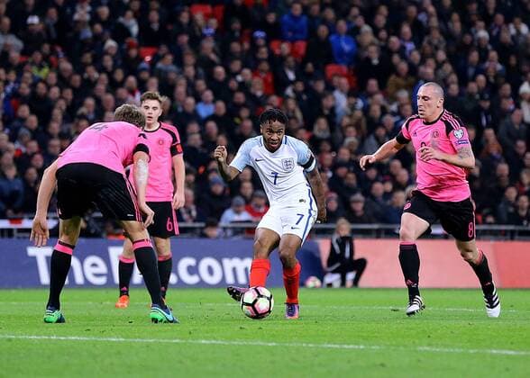 11.11.2016. Wembley Stadium, London, England. World Cup Qualifying Football. England versus Scotland. Raheem Sterling of England crosses into the Scotland area, as Scotland s Christophe Berra and Scott Brown him down xMarkxKertonx  ActionPlus11808617