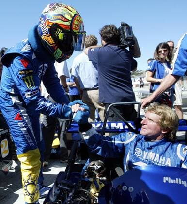 Valentino Rossi,left, congradulates Wayne Rainey after driving in an exhibition Super Kart race with Kenny Roberts Sr. and Eddie Lawson at MotoGP Red Bull U.S. Grand Prix motorcycle races in Monterey, Calif. at Mazda Raceway Laguna Seca on July 2, 2009..(Orville Myers Monterey County Herald) . MotoGP Grand Prix  - ZUMAPrix MotoGP Grand Prix