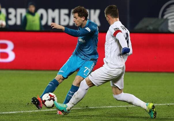 ST PETERSBURG, RUSSIA - NOVEMBER 20, 2016: Zenit St Petersburg s Luka Dordevic (L) and Krylya Sovetov Samara s Ivan Taranov fight for the ball in their 2016-17 Season Russian Premier League Round 14 football match at the Petrovsky Stadium. FC Zenit St Petersburg won the game 3-1. Peter Kovalev TASS  TS038406