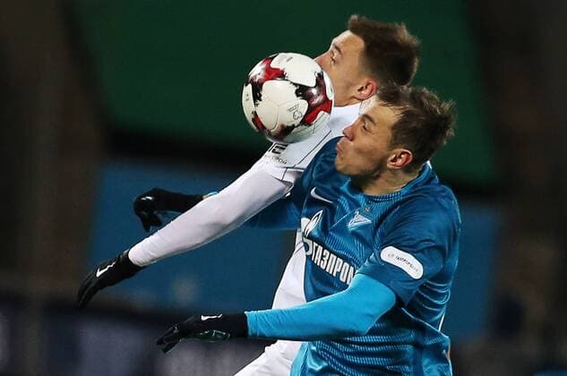 ST PETERSBURG, RUSSIA - NOVEMBER 20, 2016: Krylya Sovetov Samara s Milan Rodic (L) and Zenit St Petersburg s Artyom Dzyuba fight for the ball in their 2016-17 Season Russian Premier League Round 14 football match at the Petrovsky Stadium. FC Zenit St Petersburg won the game 3-1. Peter Kovalev TASS  TS03840B