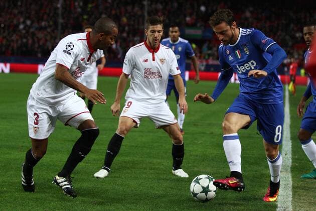 November 22, 2016 - Sevilla, Spain - Juventus midfielder Claudio Marchisio (8) and Sevilla defender Mariano (3) in action during the Uefa Champions League group stage football match n.5 SEVILLA - JUVENTUS on 22 11 2016 at the Stadio Ramon Sanchez-Pizjuan in Sevilla, Spain. Sevilla FC v Juventus - UEFA Champions League  - ZUMAn230 20161122_zaa_n230_307