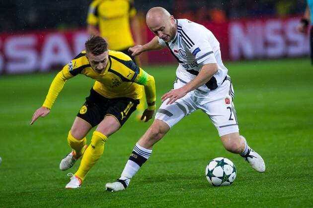 November 22, 2016 - Dortmund, Germany - Michal Pazdan of Legia Warszawa vies Marco Reus of Borussia Dortmund, during the UEFA Champions League Group F match between Borussia Dortmund and Legia Warszawa at Signal Iduna Park on November 22, 2016 in Dortmund, North Rhine-Westphalia. Borussia Dortmund v Legia Warszawa - UEFA Champions League  - ZUMAn230 20161122_zaa_n230_464