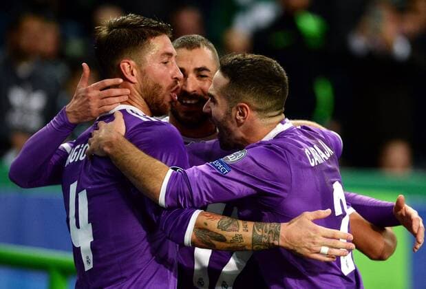 LISBON, Nov. 22, 2016 -- Real Madrid s Karim Benzema(C) celebrates scoring with his teammates Sergio Ramos(L) and Dani Carvajal during the UEFA Champions League Group F soccer match between Sporting CP and Real Madrid CF at Alvalade stadium in Lisbon, Portugal, Nov. 22, 2016. Real Madrid won 2-1. )(wll) (SP)PORTUGAL-LISBON-SOCCER-UEFA CHAMPIONS LEAGUE-SPORTING CP VS REAL MADRID ZhangxLiyun 