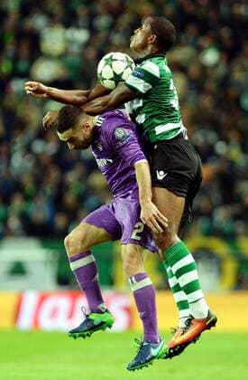 LISBON, Nov. 22, 2016 -- Real Madrid s Dani Carvajal(L) vies with Sporting CP s Marvin Zeegelaar during the UEFA Champions League Group F soccer match between Sporting CP and Real Madrid CF at Alvalade stadium in Lisbon, Portugal, Nov. 22, 2016. Real Madrid won 2-1. )(wll) (SP)PORTUGAL-LISBON-SOCCER-UEFA CHAMPIONS LEAGUE-SPORTING CP VS REAL MADRID ZhangxLiyun 